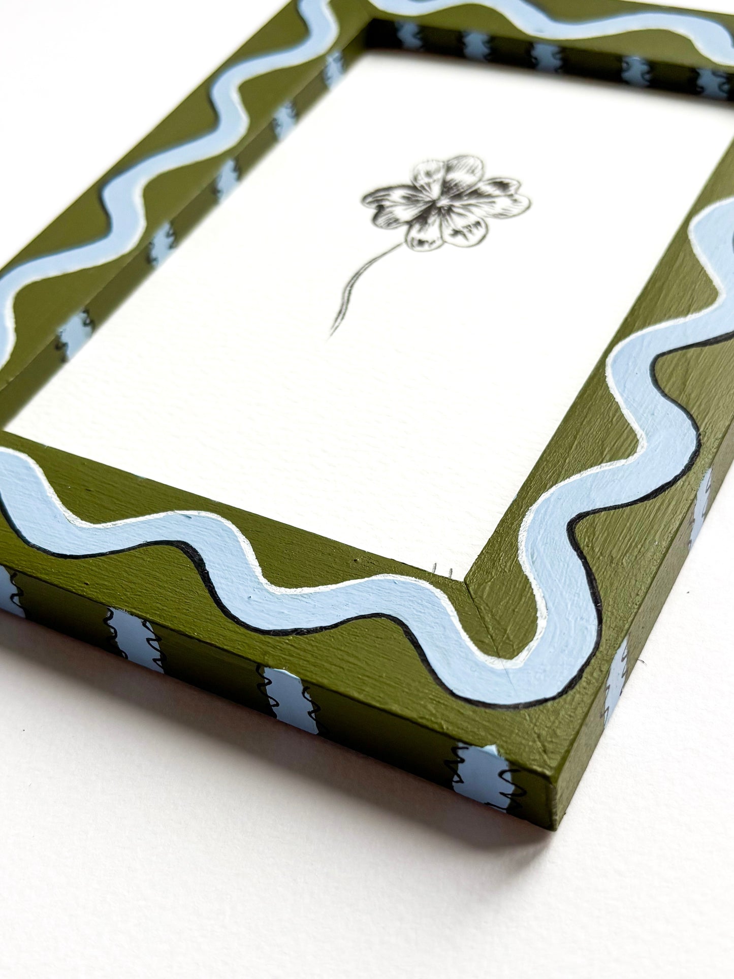 CLOVER ORIGINAL INK ARTWORK IN A HAND PAINTED GREEN AND BLUE WIGGLE AND STRIPED PRELOVED FRAME